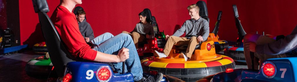 Teenagers playing on bumper cars