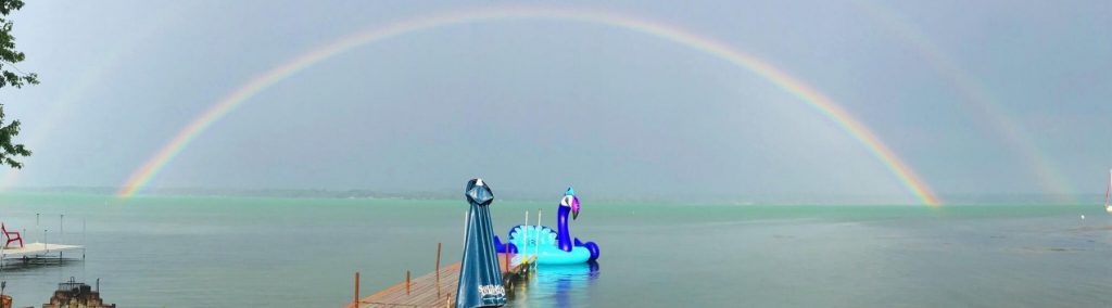 Rainbow over a lake after a rainy day