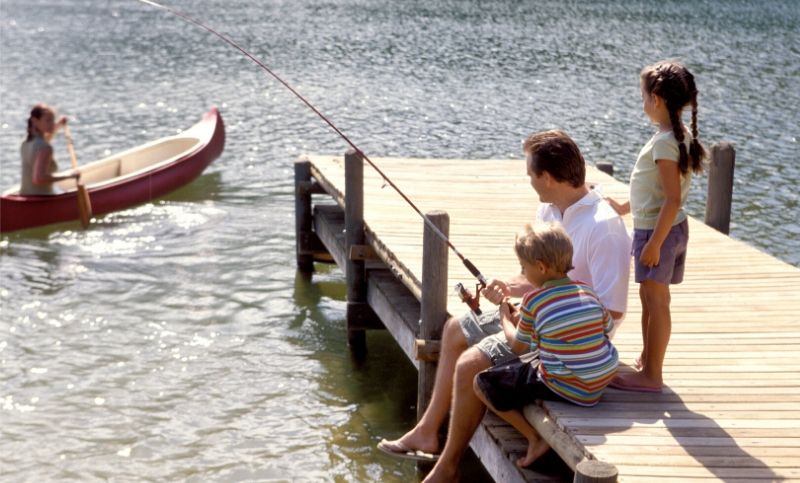 Family by the lake at a vacation rental