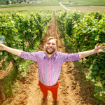 finger lakes wine trails , man in vineyard
